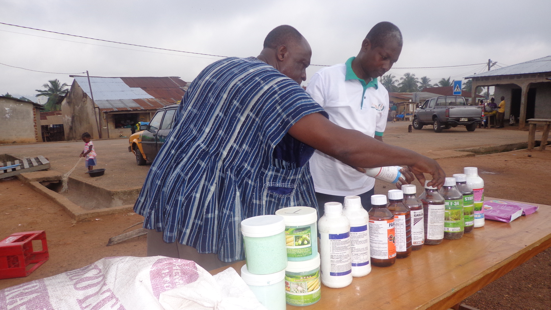 Group of people posing outside a building holding documents in Ghana